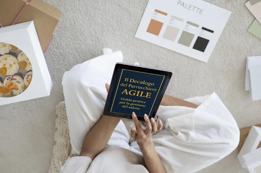 Mockup dell'ebook Il Decalogo del Parrucchiere AGILE visualizzato sullo schermo di un tablet.